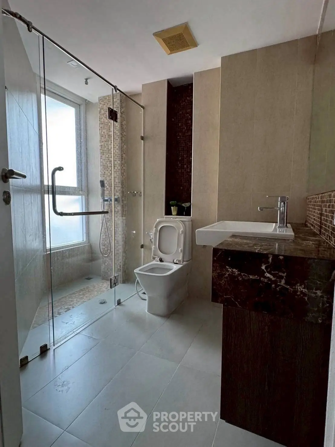 Modern bathroom with glass shower and sleek fixtures