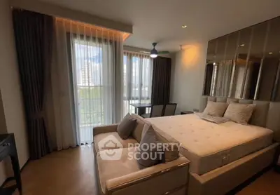 Luxurious bedroom with large windows and elegant decor in modern apartment