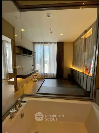 Luxurious modern bathroom with a view into a stylish study room, featuring elegant design and ample natural light.