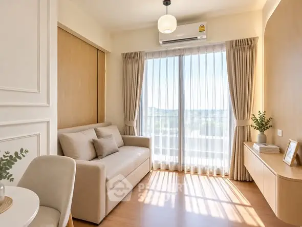 Bright and cozy living room with modern decor and large window view.