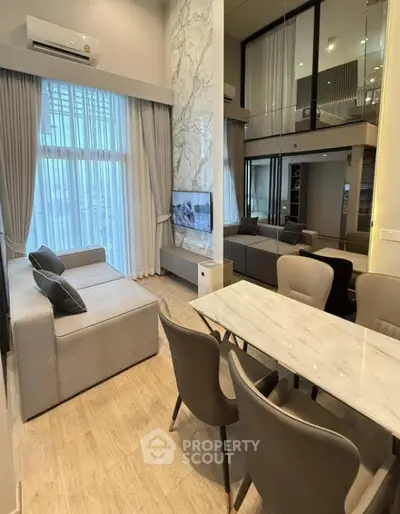 Luxurious modern living room with high ceilings and elegant decor