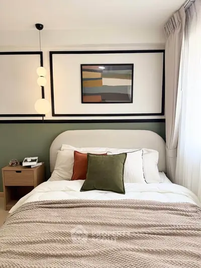 Cozy bedroom with modern decor, featuring a stylish bed, elegant lighting, and a framed artwork above the headboard.