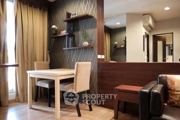 Stylish modern living room with elegant dining area and chic decor.