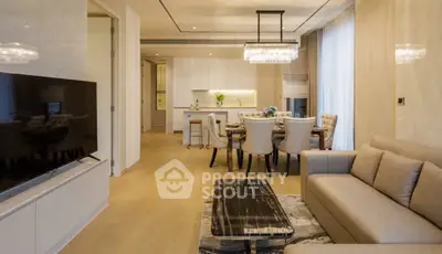 Luxurious open-plan living and dining area with elegant furnishings and modern decor.