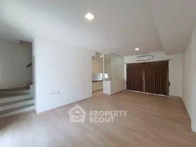 Spacious modern living room with open layout and wooden flooring