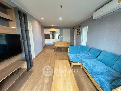 Spacious living room with modern furniture and wooden flooring