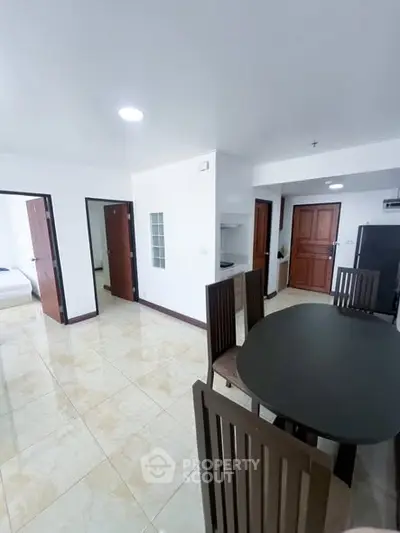 Spacious modern apartment with open dining area and sleek design