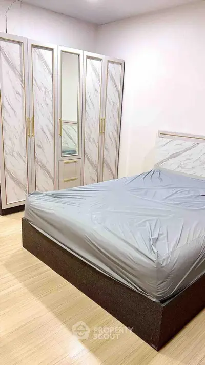 Modern bedroom with stylish wardrobe and sleek bed design