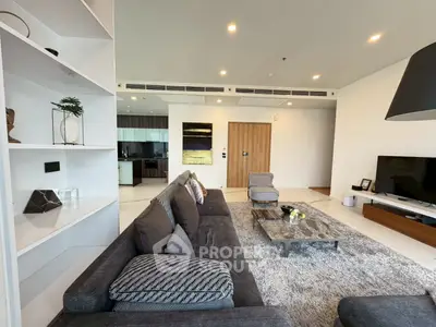 Spacious modern living room with elegant decor and open kitchen layout