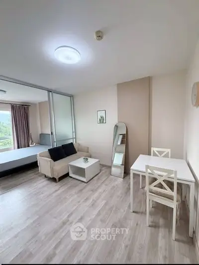 Modern studio apartment with open layout and stylish furnishings