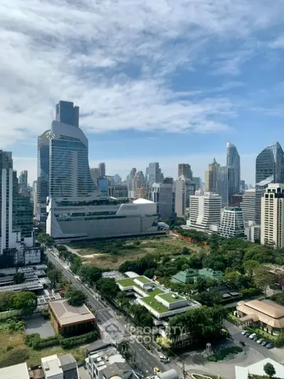 Stunning cityscape view with modern skyscrapers and lush greenery, perfect for urban living enthusiasts.