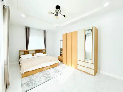 Bright modern bedroom with stylish furniture and natural light
