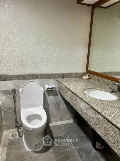 Modern bathroom with sleek design and granite countertop