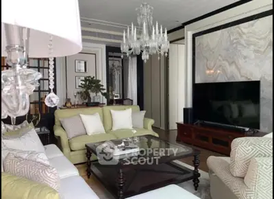 Luxurious living room with elegant chandelier and modern decor