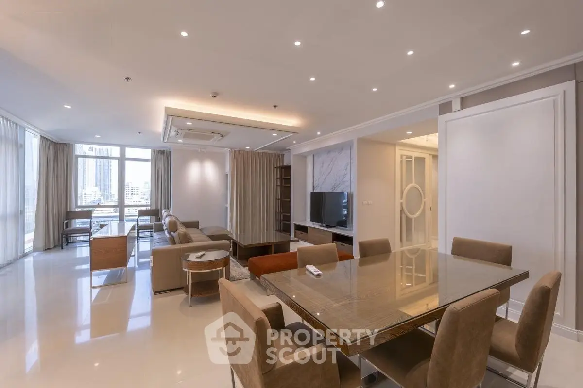 Spacious modern living room with elegant dining area and city view.