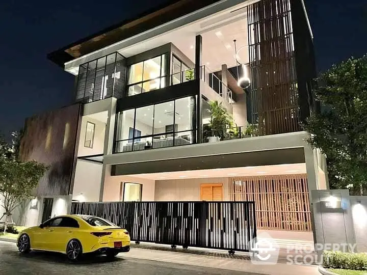 Luxurious modern house with sleek architecture and stylish yellow car at night