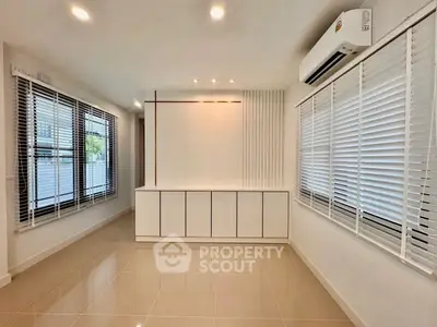 Spacious modern living room with sleek design and large windows