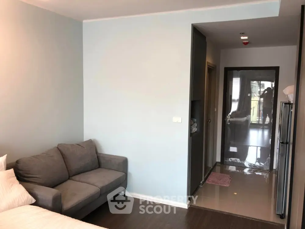 Modern apartment interior with cozy sofa and sleek hallway design