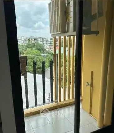 Charming balcony with city view, perfect for relaxation and enjoying the outdoors.
