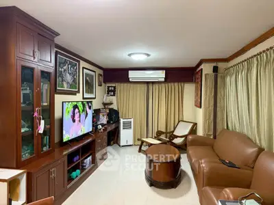 Cozy living room with elegant wooden furniture and modern amenities