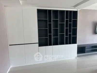 Modern built-in storage unit with sleek design in a contemporary living space.