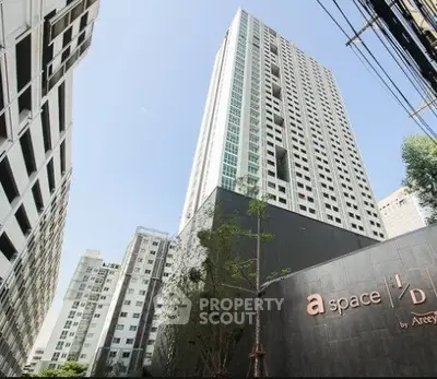 Modern high-rise condominium building with sleek design and urban appeal.