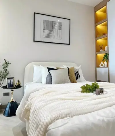 Cozy modern bedroom with stylish decor and soft lighting
