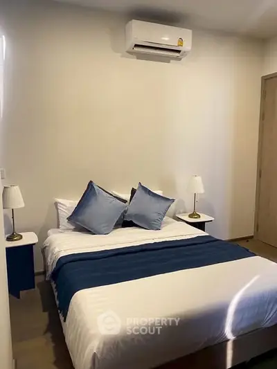 Cozy bedroom with modern air conditioning and stylish decor