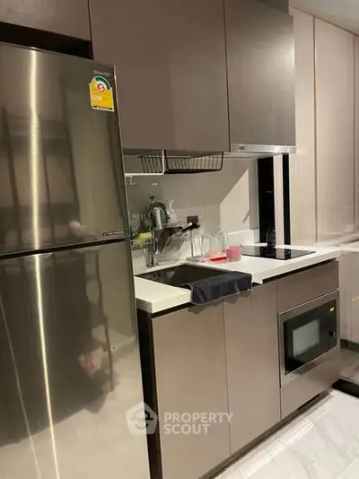 Modern kitchen with sleek cabinetry and stainless steel appliances