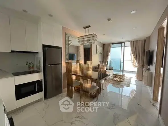 Luxurious open-plan kitchen and living room with modern decor and natural light