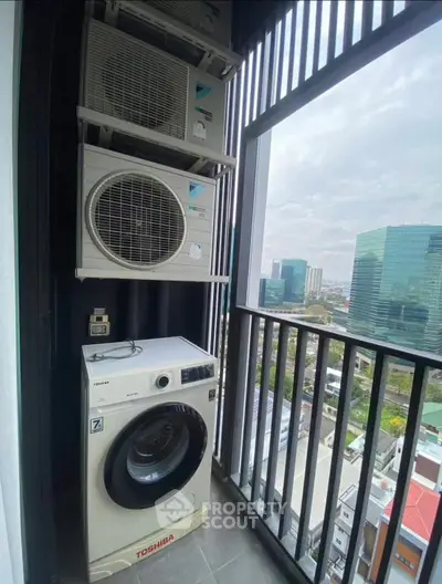 Modern balcony with washing machine and city view, perfect for urban living.