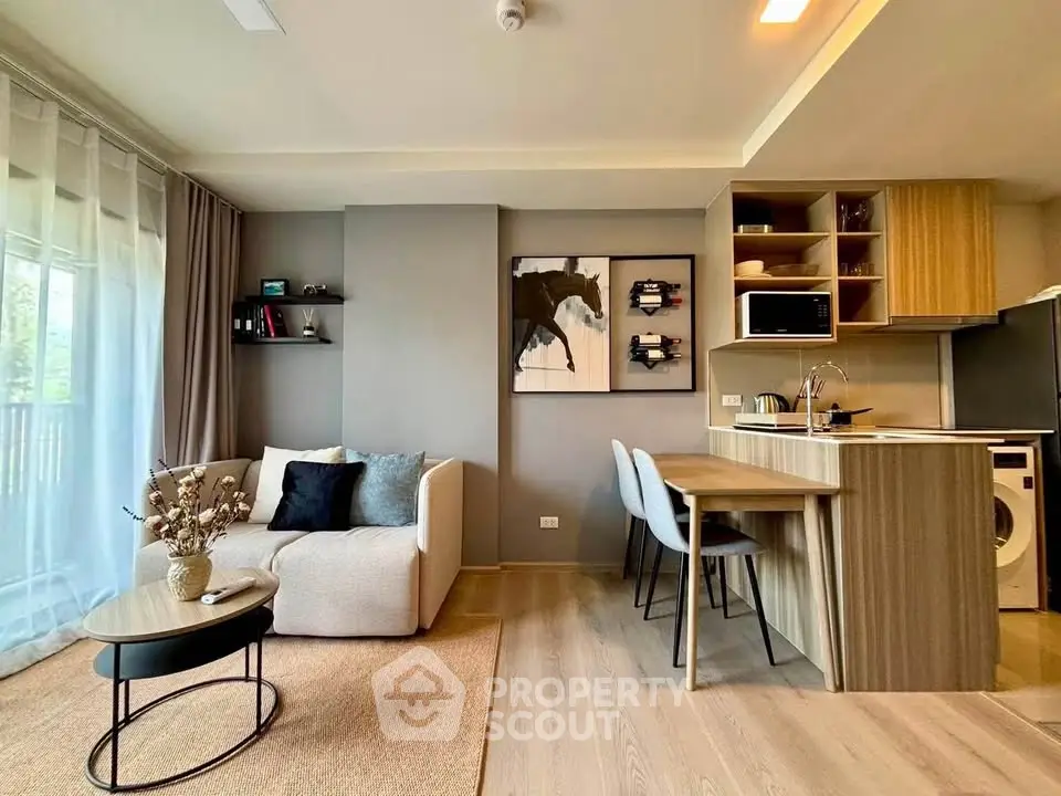 Modern open-plan living room with stylish kitchen and cozy seating area