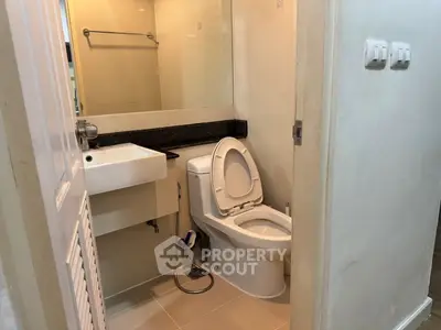 Compact bathroom with modern fixtures and sleek design