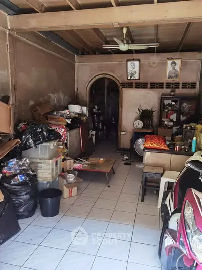 Spacious storage area with tiled floor and ample shelving space.