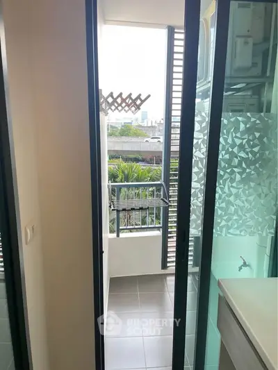 Charming balcony with city view, perfect for relaxation and enjoying the outdoors.