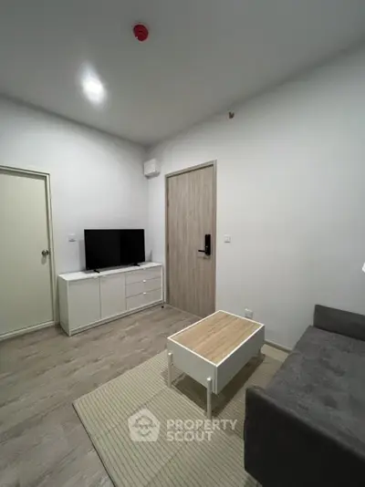Modern living room with sleek furniture and minimalist design