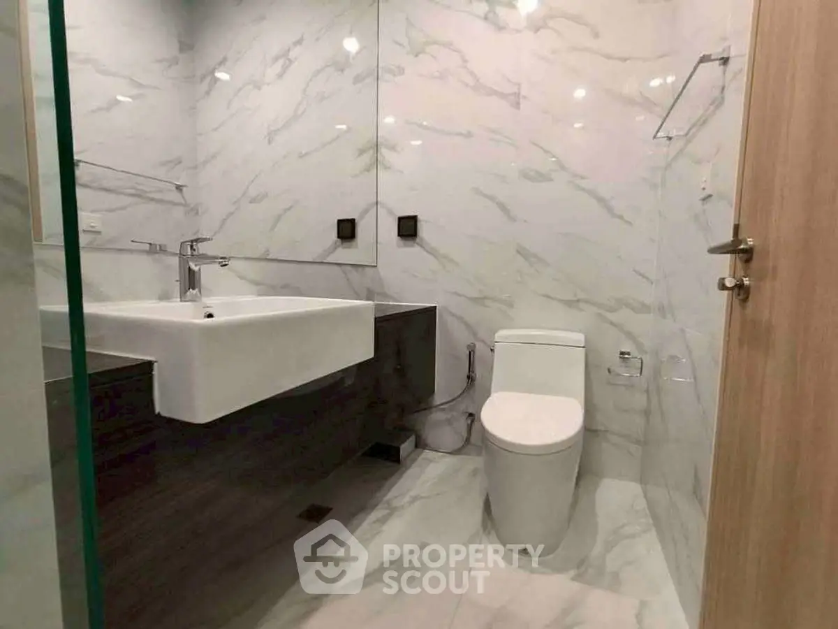 Modern bathroom with sleek design and marble walls