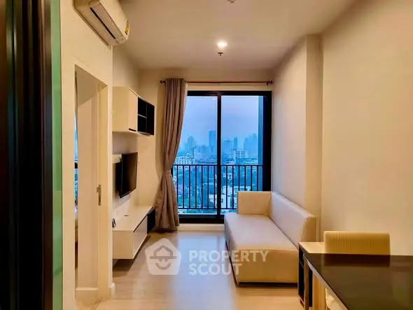 Modern living room with city view, featuring sleek furniture and large window for natural light.