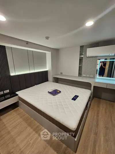 Modern bedroom with sleek design and built-in storage solutions