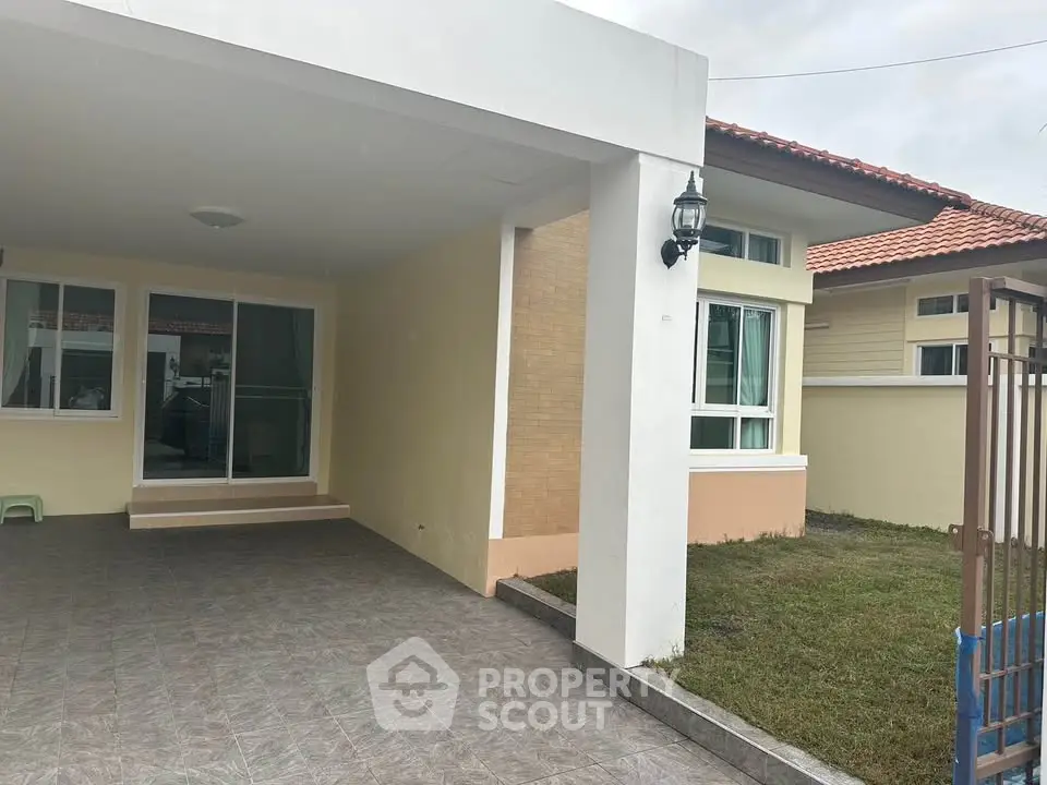 Charming single-story home with spacious driveway and lush green lawn