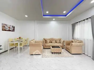 Elegant living room with modern beige furniture and stylish dining area