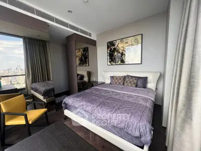 Luxurious bedroom with city view, modern decor, and elegant furnishings in high-rise apartment.