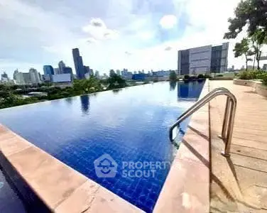 Stunning rooftop infinity pool with city skyline view