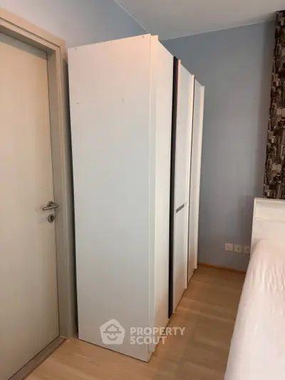 Spacious bedroom with modern wardrobe and sleek design