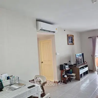 Cozy living room with air conditioning and modern entertainment setup