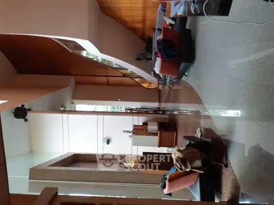 Spacious modern living room with high ceilings and elegant decor