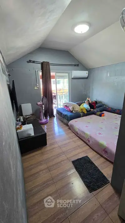 Cozy bedroom with modern decor and balcony access