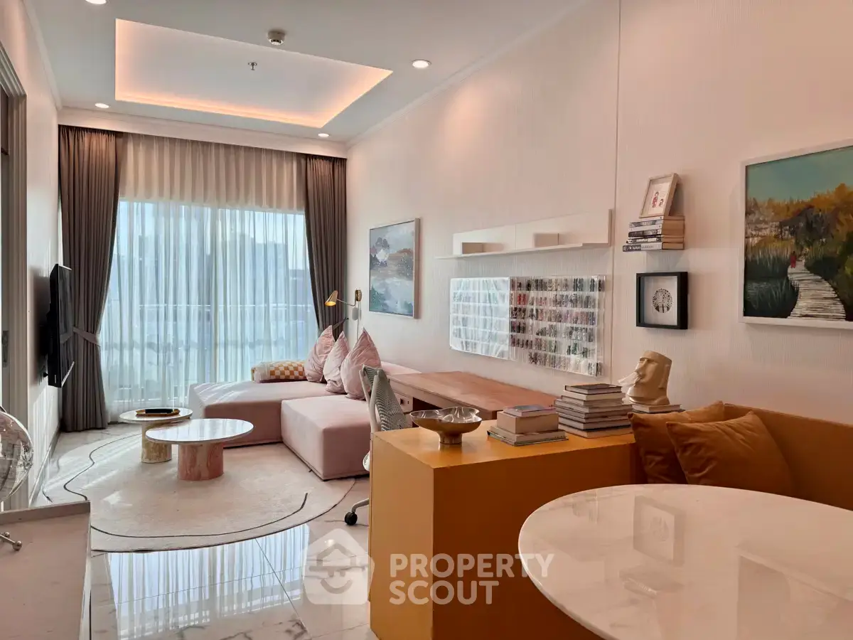 Stylish modern living room with elegant decor and large windows for natural light.