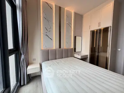 Modern bedroom with stylish lighting and built-in wardrobe