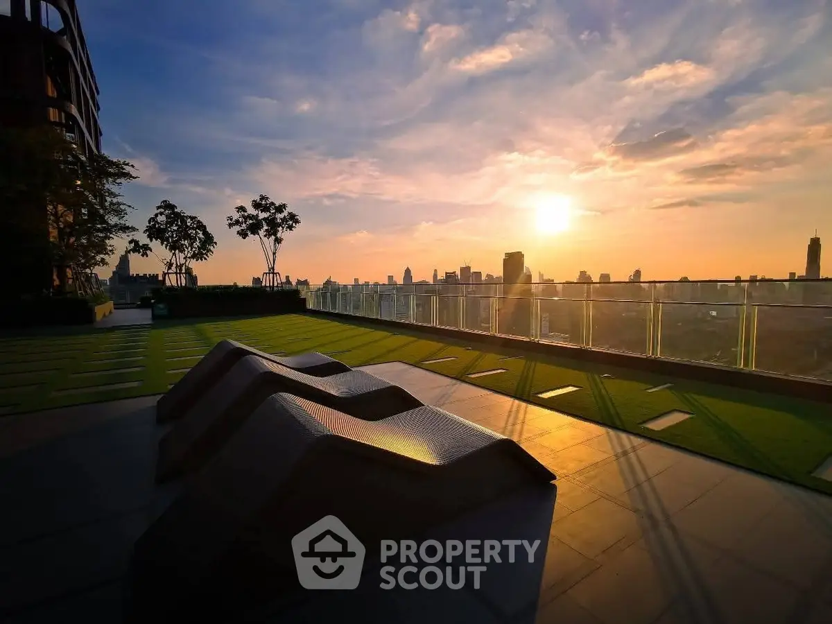 Stunning rooftop view with modern design and sunset skyline
